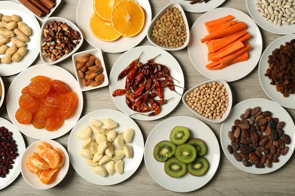 Different products on saucers — Stock Photo, Image