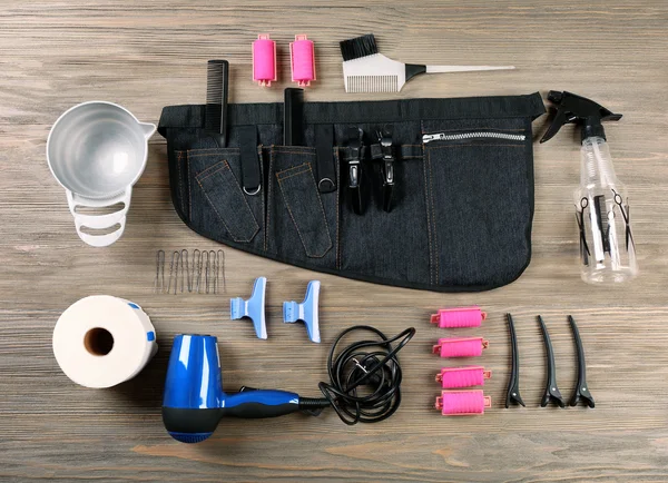 Hairdressing tools on wooden background — Stock Photo, Image