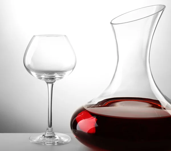 Glass carafe of wine on light background — Stock Photo, Image