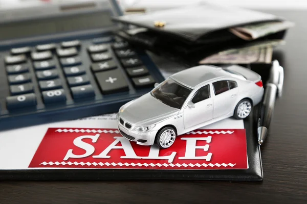 Tablet, calculator and toy car on table close-up — Stock Photo, Image