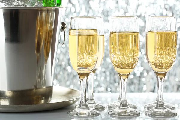 Glasses of champagne on bright background — Stock Photo, Image