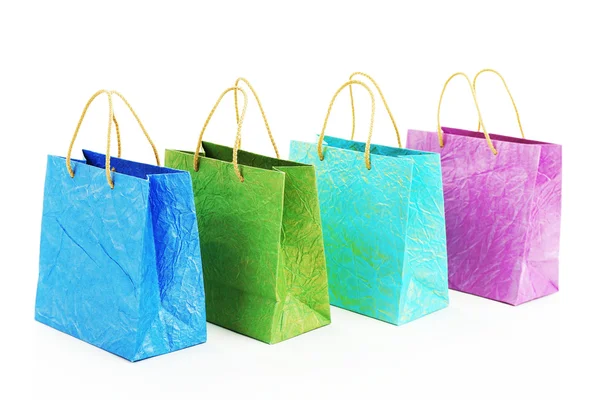 Kleurrijke winkelstraten papieren zakken geïsoleerd op wit — Stockfoto