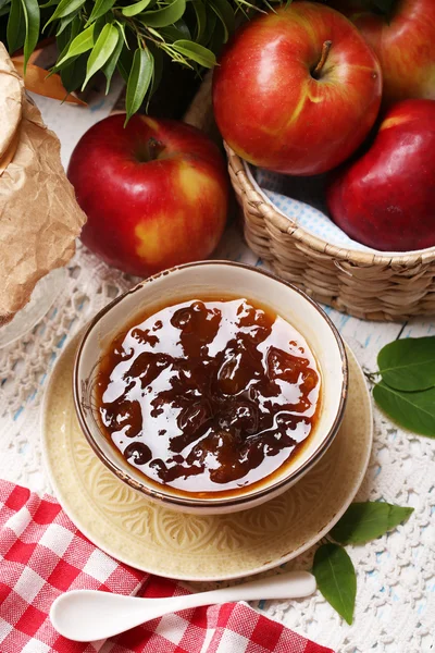 Apple jam and fresh red apples