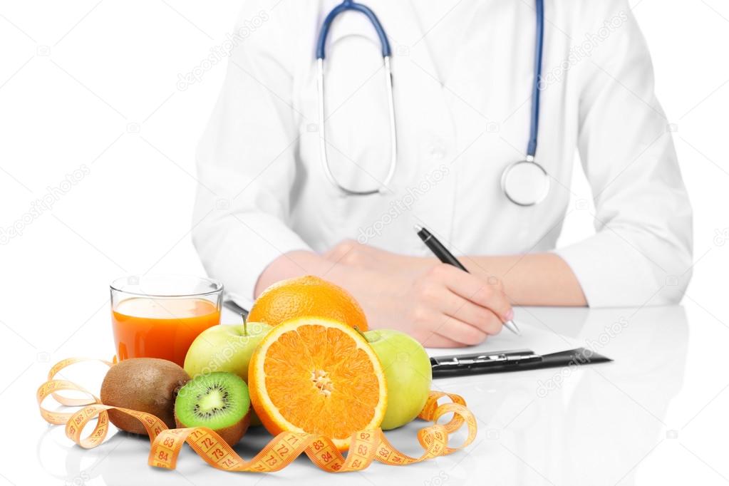Nutritionist doctor writing  diet plan, isolated on white