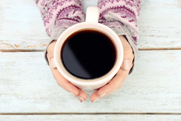 Female hands holding cup of coffee — Stock Photo, Image