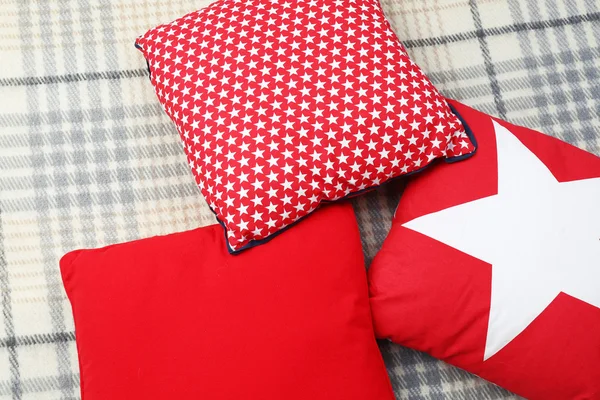 Decorative pillows on plaid close up — Stock Photo, Image