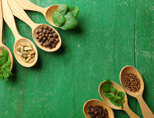 Wooden spoons with fresh herbs