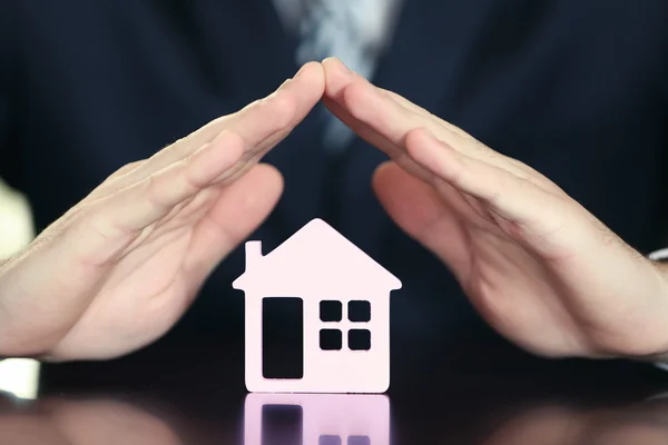Male hands with model of house, closeup — Stock Photo, Image