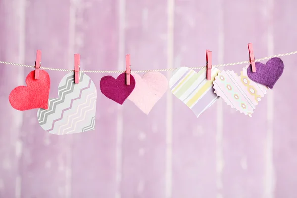 Bright hearts hanging on rope — Stock Photo, Image