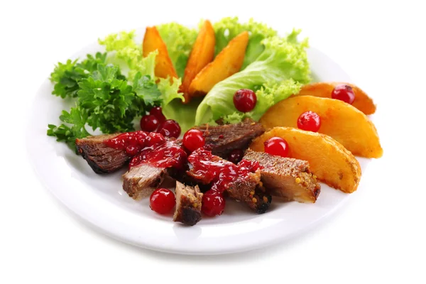 Beef with cranberry sauce, roasted potato slices — Stock Photo, Image