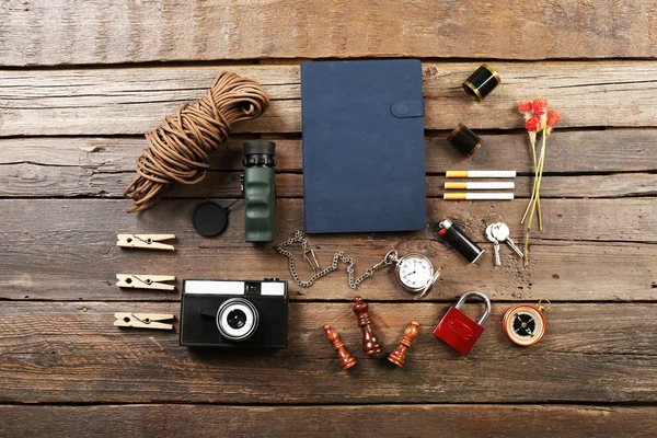 Hiking gear on wooden background — Stock Photo, Image