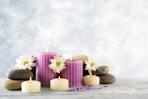 Still life with spa candles on light wallpaper background — Stock Photo, Image