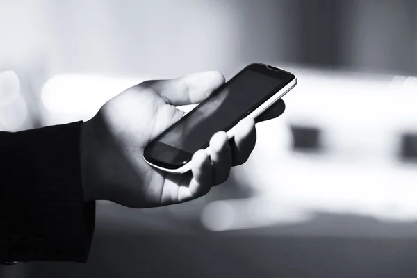 Mobile phone in male hand, closeup — Stock Photo, Image