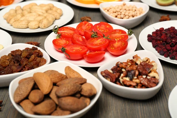 Different products on saucers — Stock Photo, Image