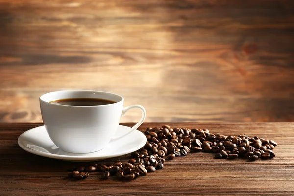 Cup of coffee with grains — Stock Photo, Image