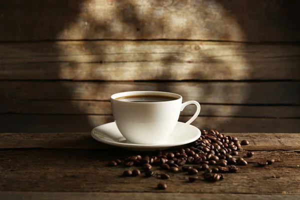 Cup of coffee with grains — Stock Photo, Image