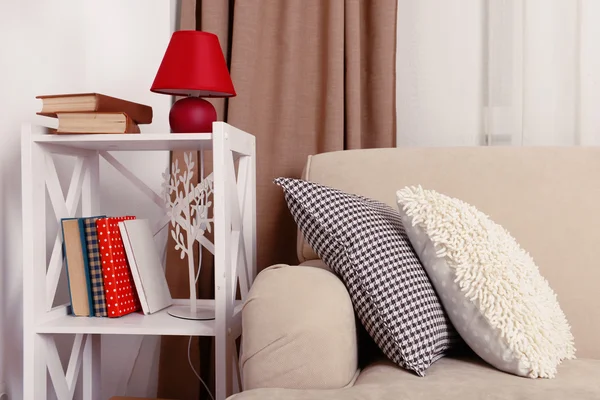 Sofa with colorful pillows in room — Stock Photo, Image