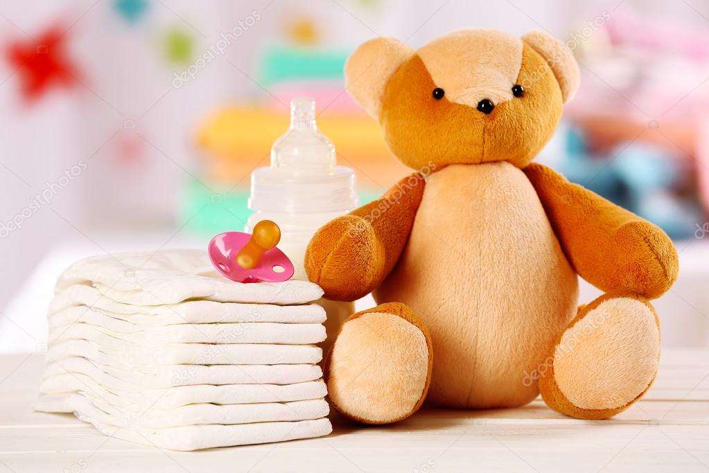 Baby accessories on table on light background