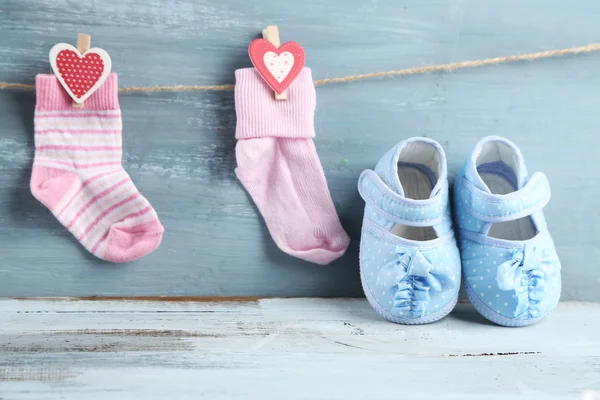 Cute toddler shoes on wooden background — Stock Photo, Image
