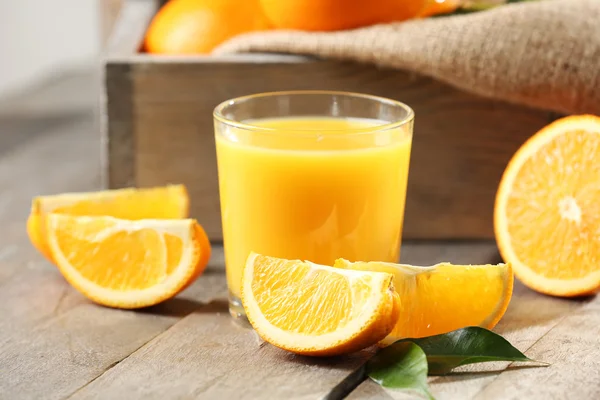 Orange juice on table — Stock Photo, Image