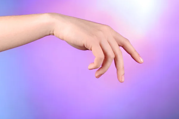 Female hand on colorful background — Stock Photo, Image