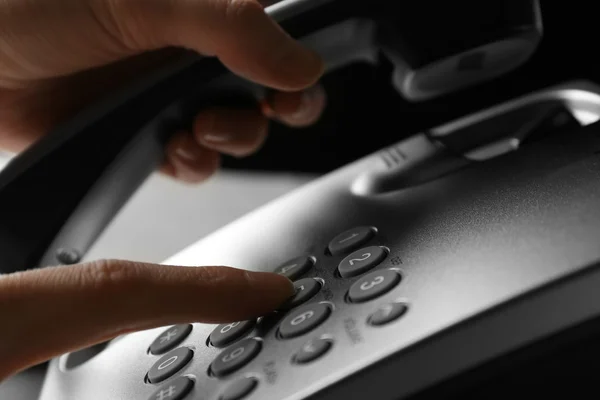 Finger pressing number button on telephone to make a call, close up — Stock Photo, Image