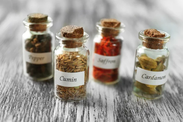 Assortment of spices in glass bottles — Stock Photo, Image