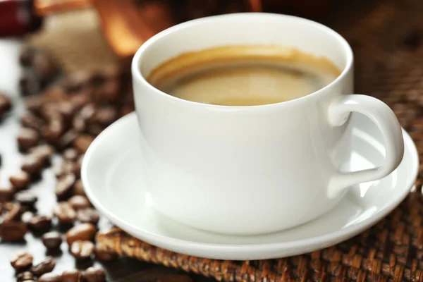 Cup of coffee with beans — Stock Photo, Image