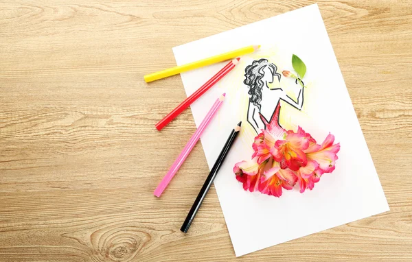 Picture with flower petals and pencils