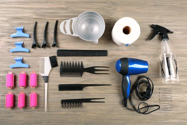 Hairdressing tools on wooden background — Stock Photo, Image