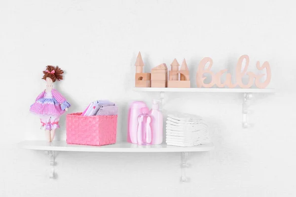 Baby accessories on shelves close-up — Stock Photo, Image