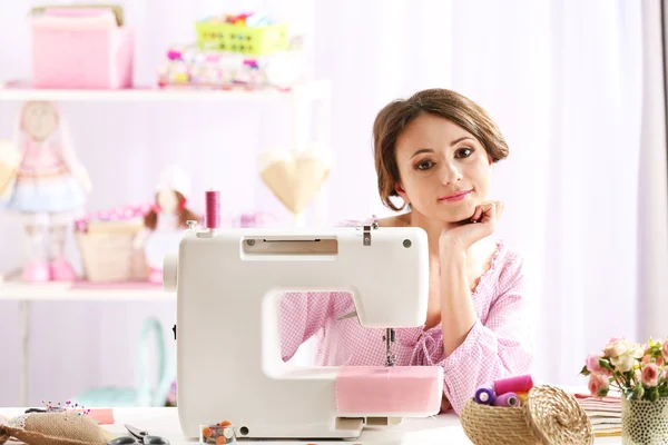 Beautiful young needlewoman in workshop — Stock Photo, Image