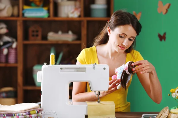 Beautiful young needlewoman in workshop — Stock Photo, Image