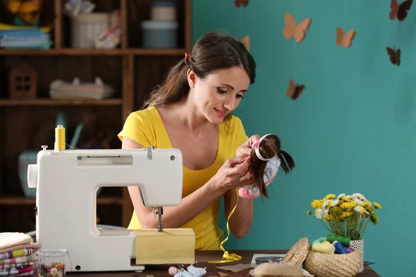 Beautiful young needlewoman in workshop — Stock Photo, Image