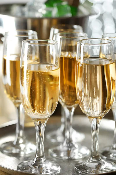 Glasses of champagne on bright background — Stock Photo, Image