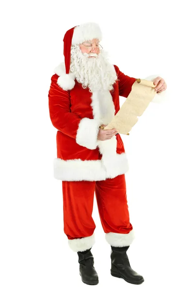 Santa Claus holding wish list, isolated on white background — Stock Photo, Image