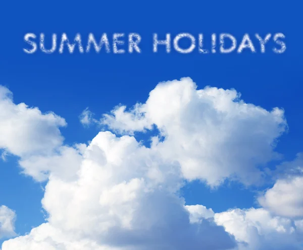 SUMMER HOLIDAYS written in the blue sky — 图库照片