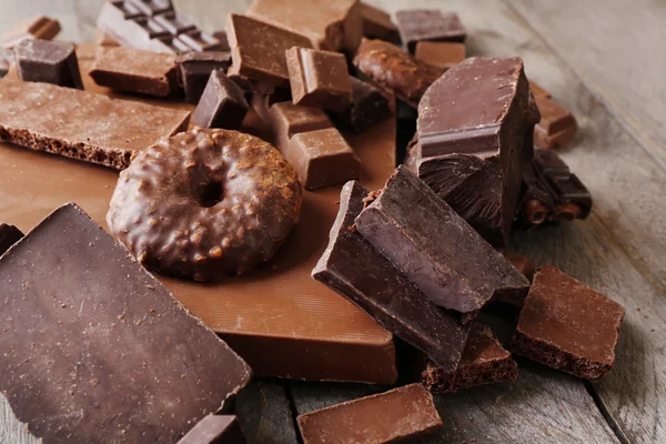 Set of chocolate on wooden table, closeup — Stock Photo, Image