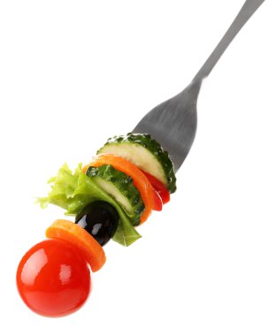 farklı sebze üzerinde beyaz izole çatal