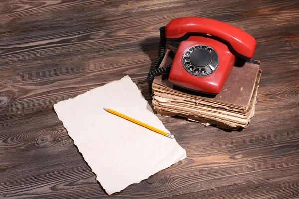 Retro red telephone on table — Stock Photo, Image