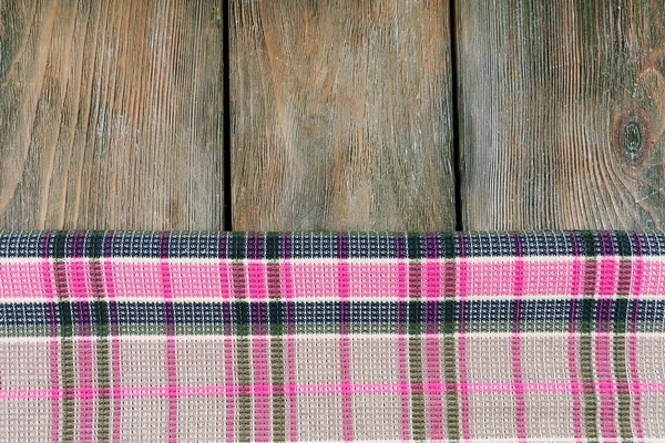 Checkered napkin on wooden table background — Stock Photo, Image