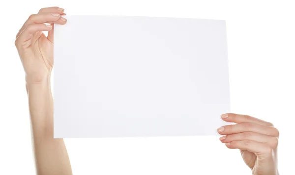 Manos sosteniendo tarjeta en blanco aisladas en blanco — Foto de Stock