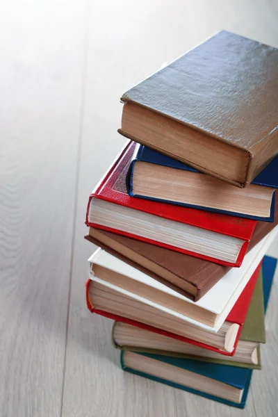 Stack of books on wooden background — Stock Photo, Image