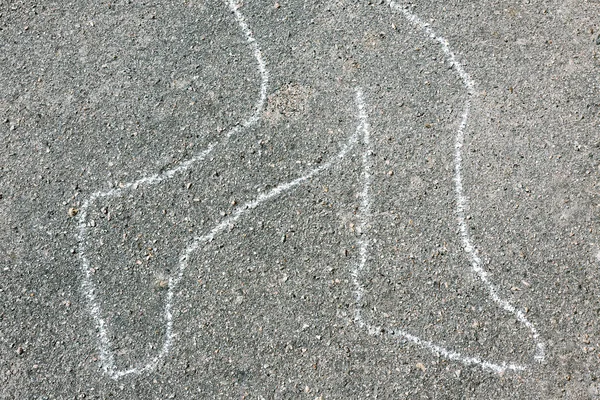 Chalk outline of body dead on pavement