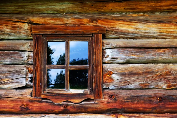 Wooden wall with old window — Stock Photo, Image