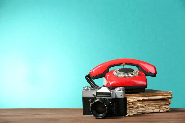 Retro camera with old book and telephone — Stock Photo, Image