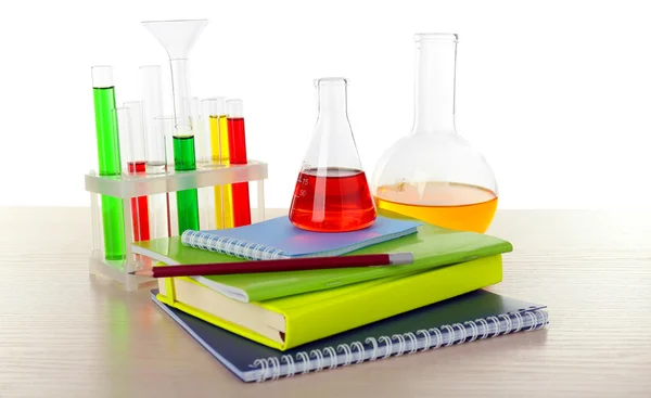 Desk with books and test tubes