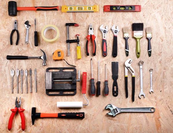 Set of tools on plywood, top view — Stock Photo, Image