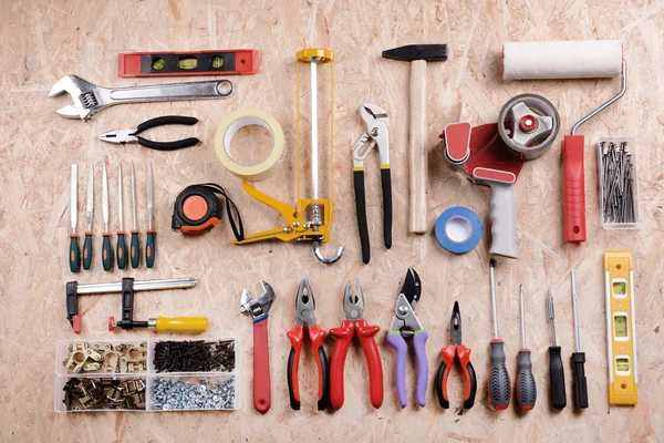 Set van tools op triplex, bovenaanzicht — Stockfoto