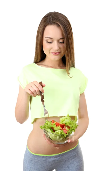 Молодая стройная женщина со стеклянной миской диетического салата, изолированного на белом — стоковое фото